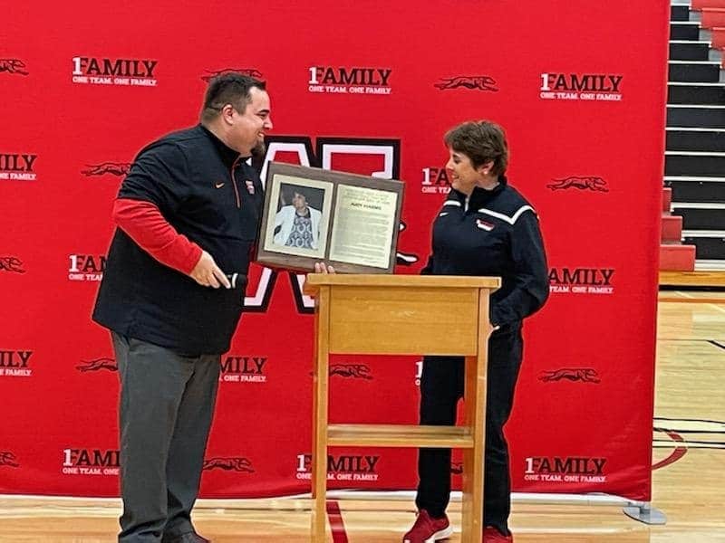 AD Justin Crandall Presenting Coach Harms with the Plaque