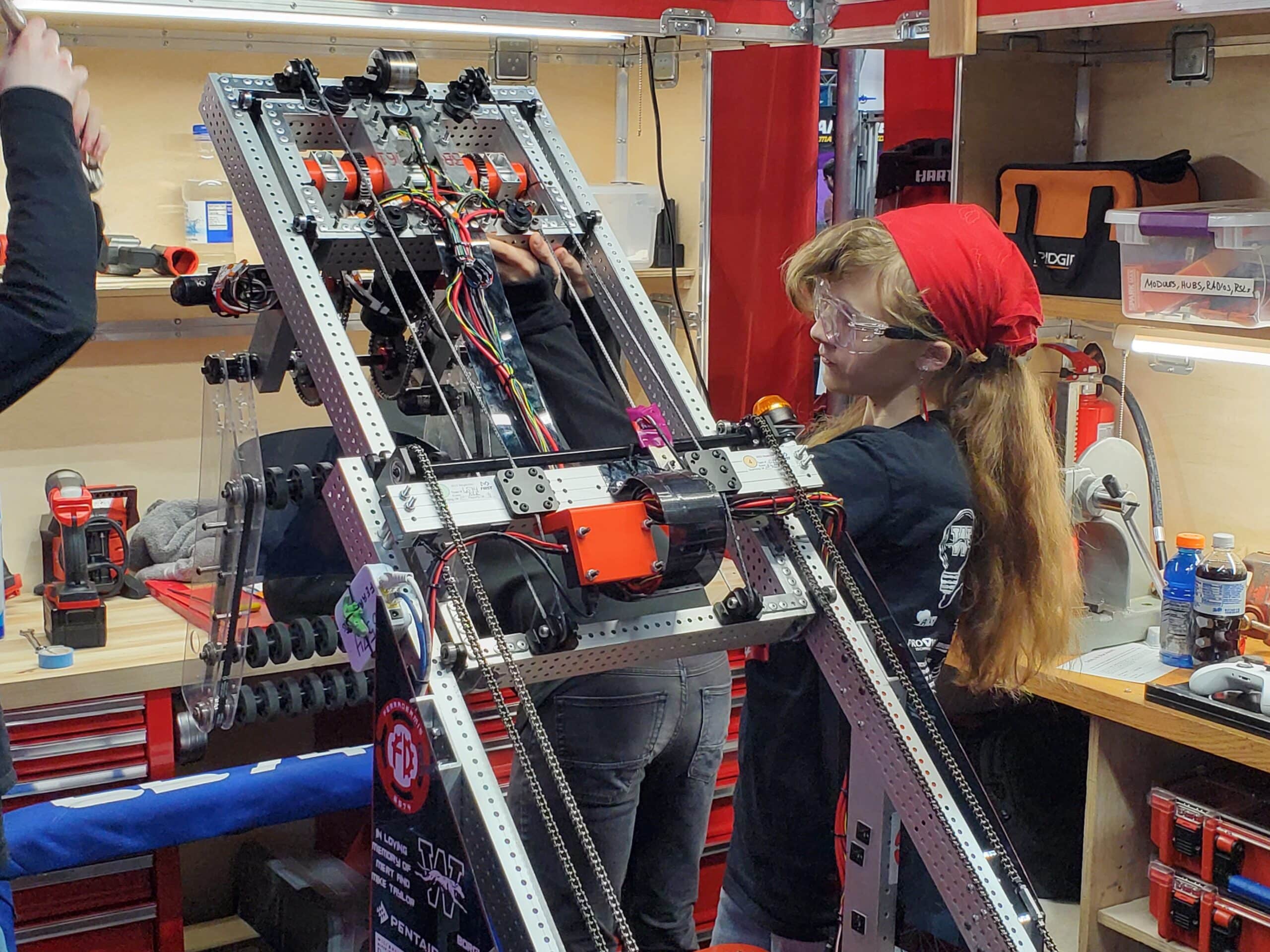 Electrical Team Member Elora Wildermuth-Breitzman works on the Robot Between Matches