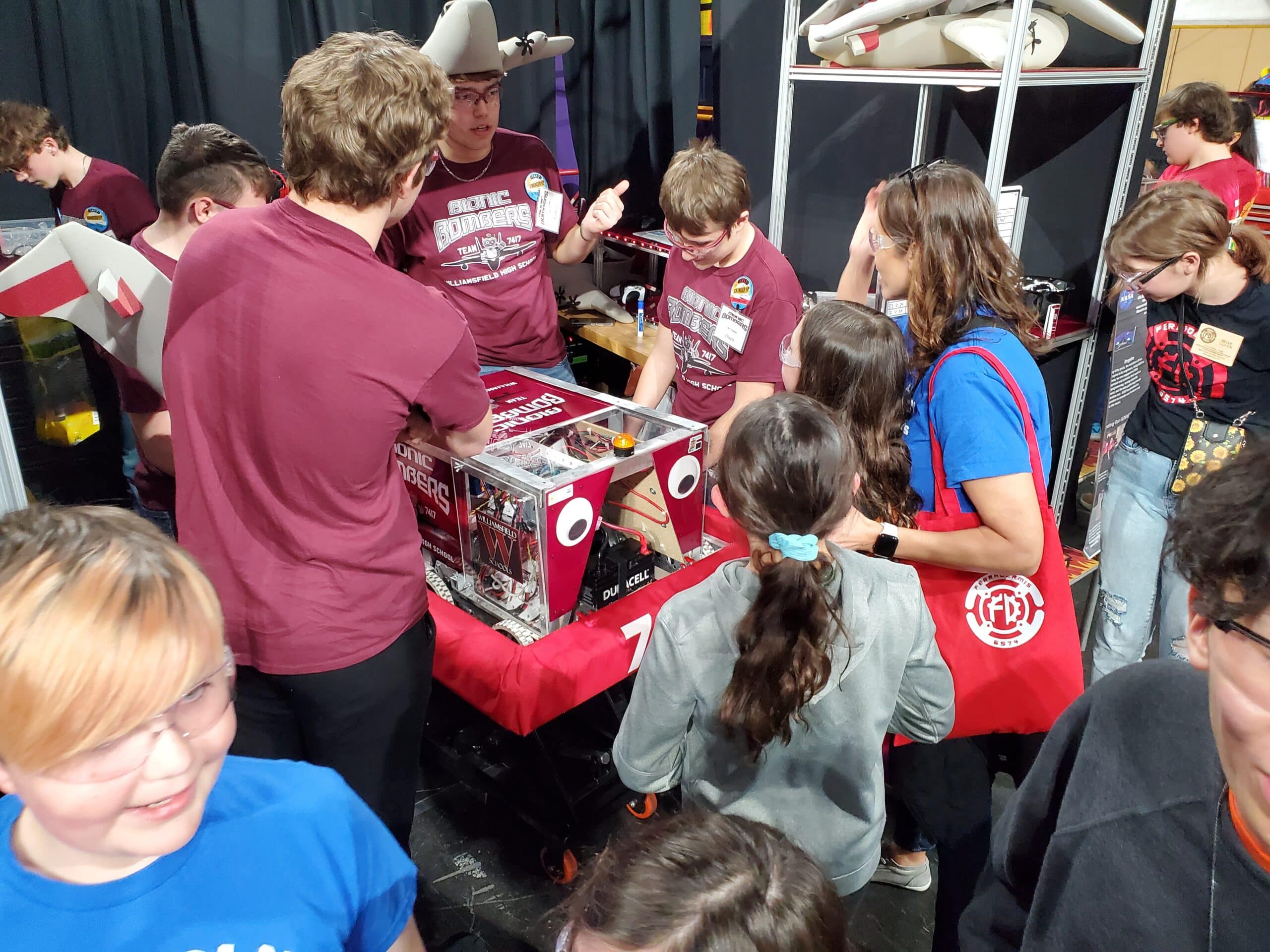 Lincoln FLL Students Talk with Another Team About their Robot in the Pits