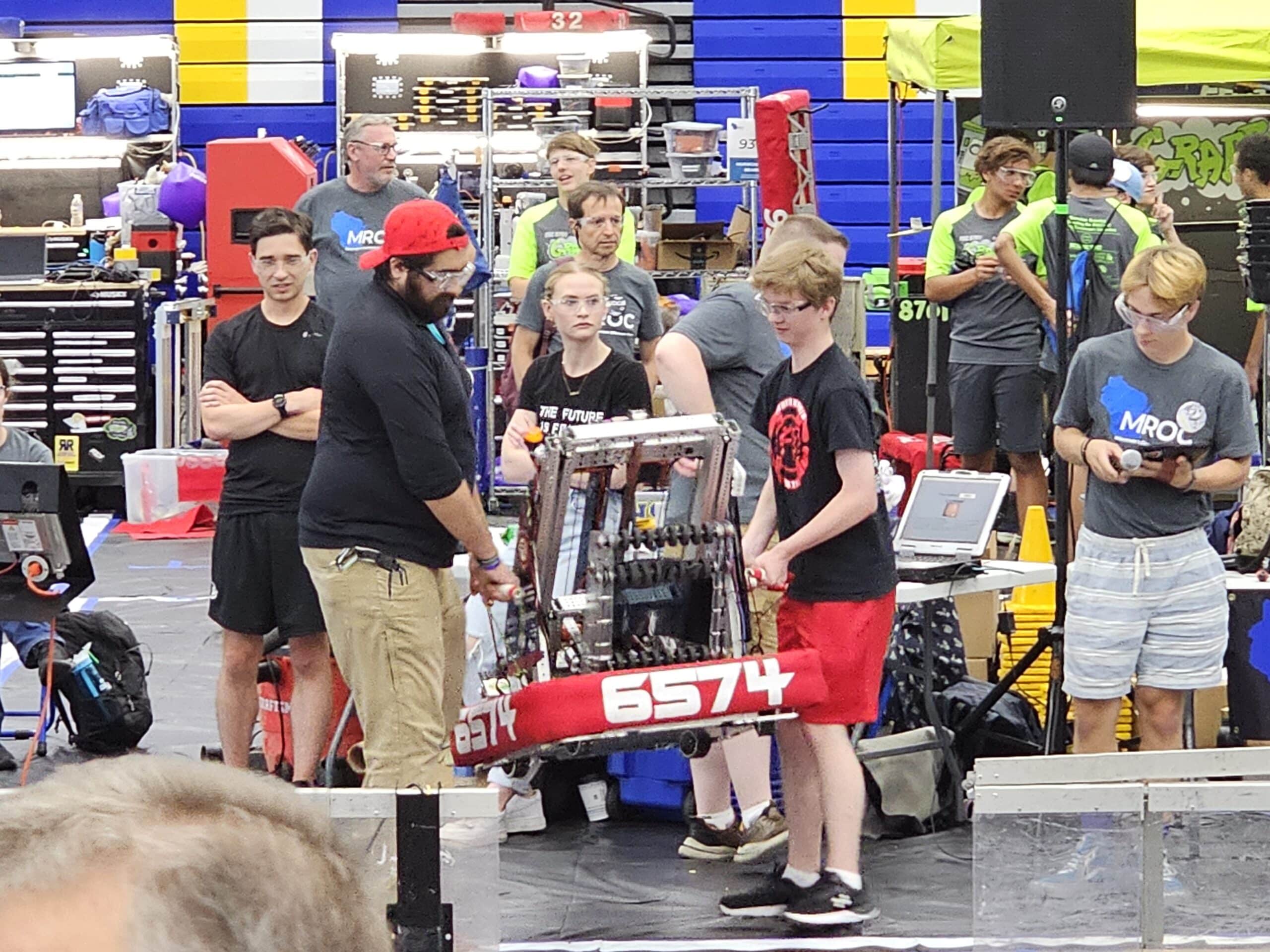 For one fun-only match, the mentors got to drive the robots in a match coached by students
