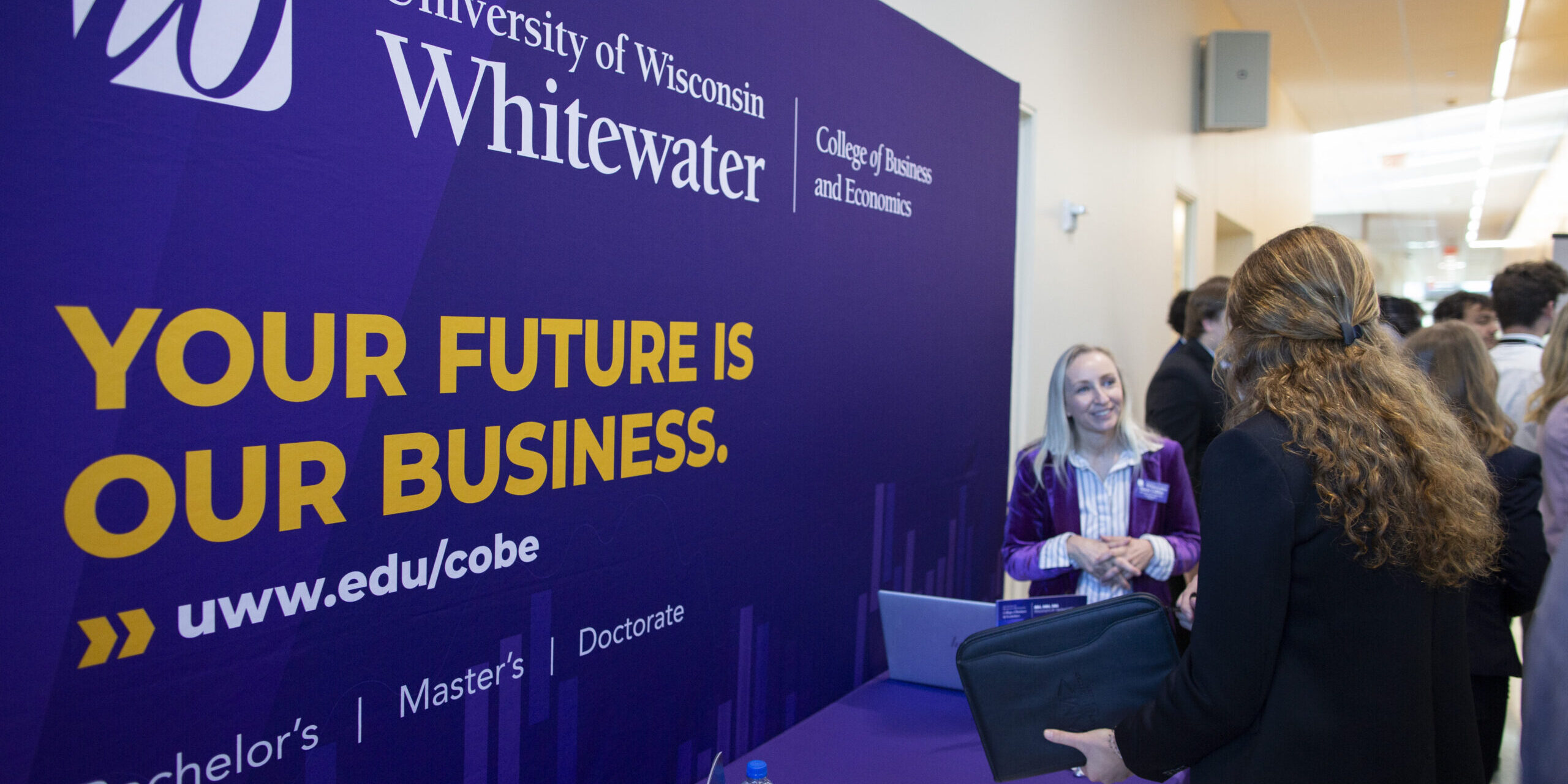 Stacie Collins, outreach program coordinator in the Office of Continuing Education, promotes the UW-Whitewater doctor of business administration degree. The first in-person AMA Regional Marketing Conference since 2019 returned to Hyland Hall on Friday, Oct. 7, 2022, with students from 28 universities coming to campus to network, hear speakers and compete in sales and marketing competitions. (UW-Whitewater Photos/Craig Schreiner)