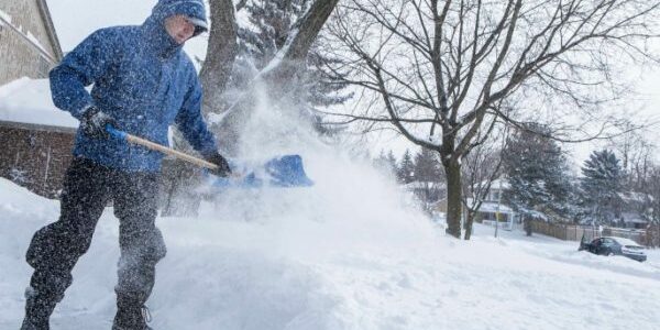 man-shoveling-snow-from-sidewalk-after-storm-16x9-686x457